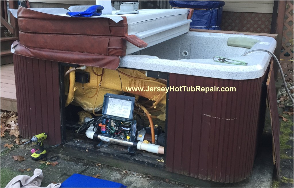 A hot tub with the front access wall removed